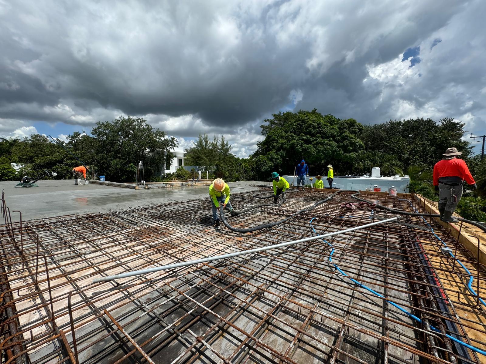 ABM crew placing a reinforced concrete structural slab